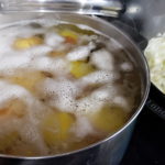 Picture of potatoes parboiling.