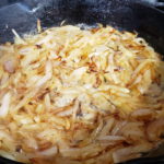 Picture of Slivered Onions caramelizing.