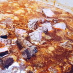 Picture of broth and beef added to stew.