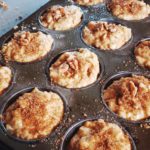 Picture of muffin batter with toppings in tin before baking