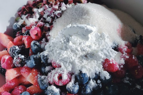 Picture of added cornstarch, lemon, and sugar to berries