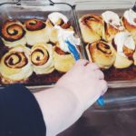 Frosting warm Cinnamon Rolls